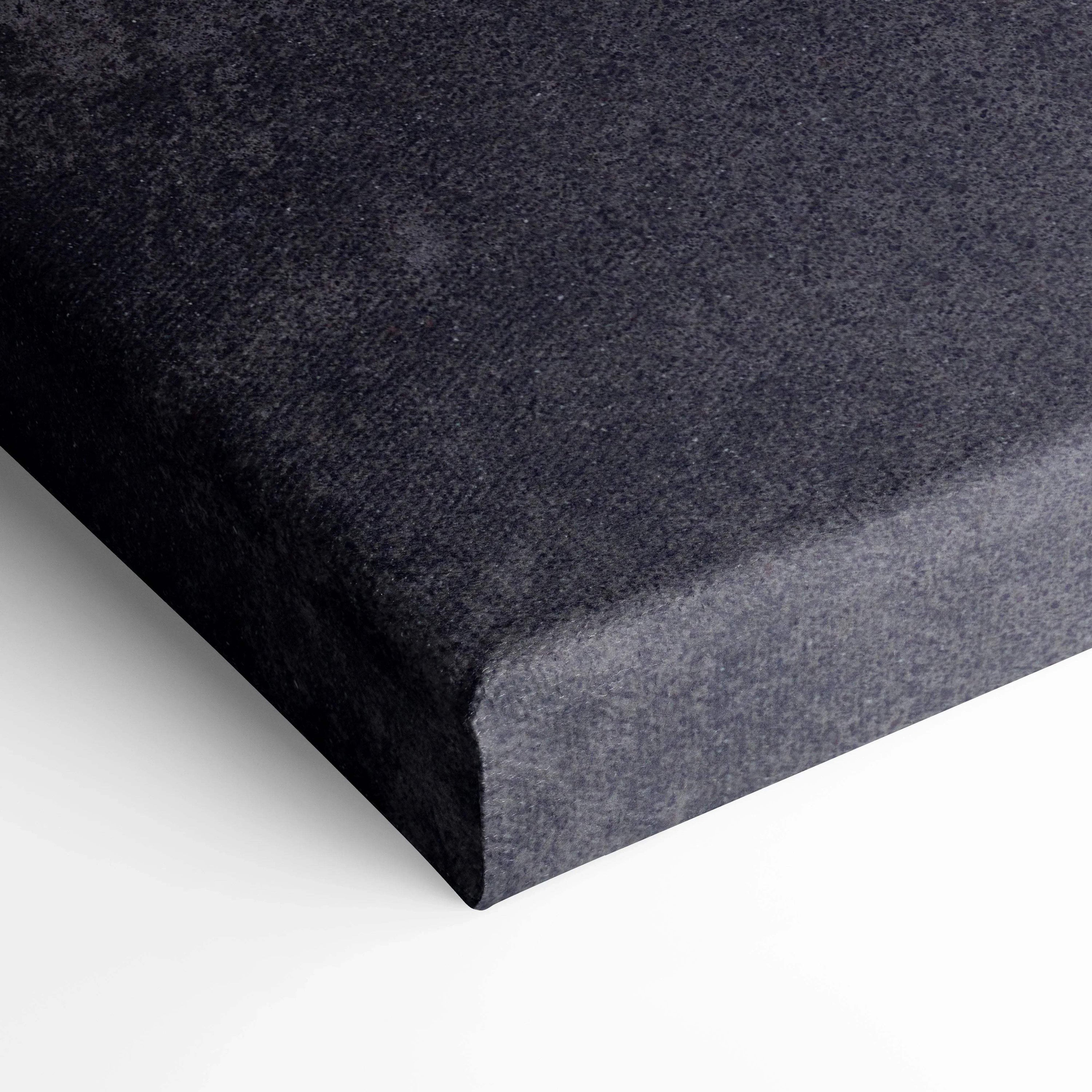 Close-up of black textured canvas edge showcasing museum-quality wall art wrap.