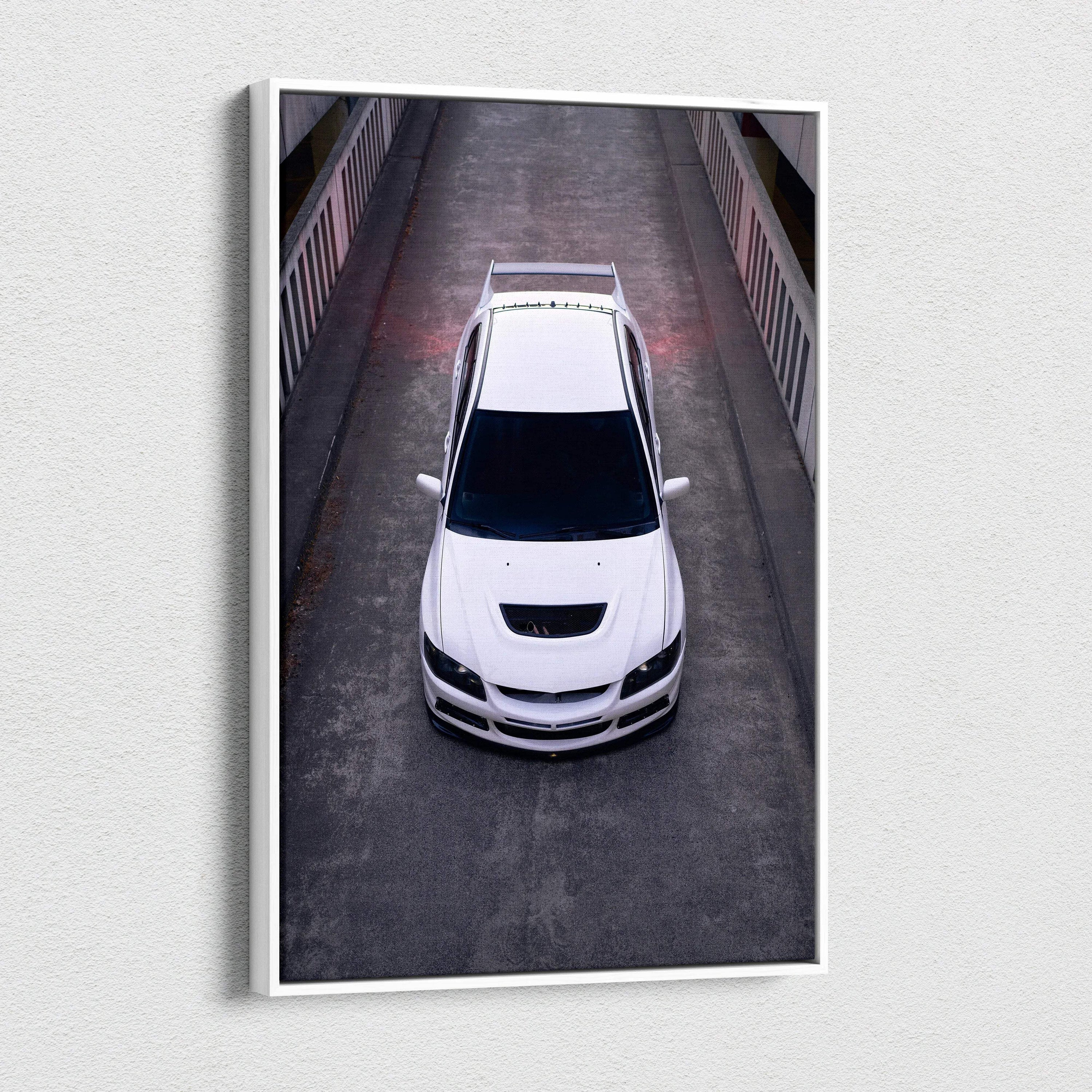 White Mitsubishi Evo 8 from above on dark road, vertical canvas wall art print.