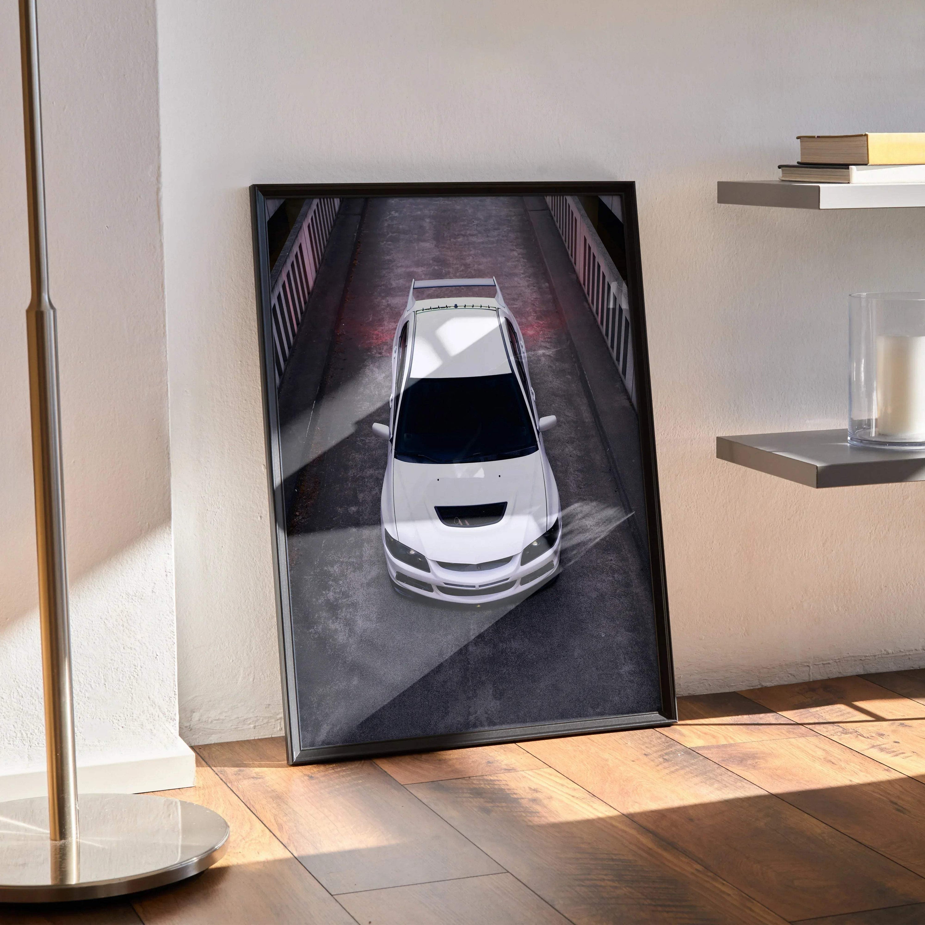 Framed Mitsubishi Evo 8 JDM car wall art poster in high-resolution, angled top-down view in modern room.