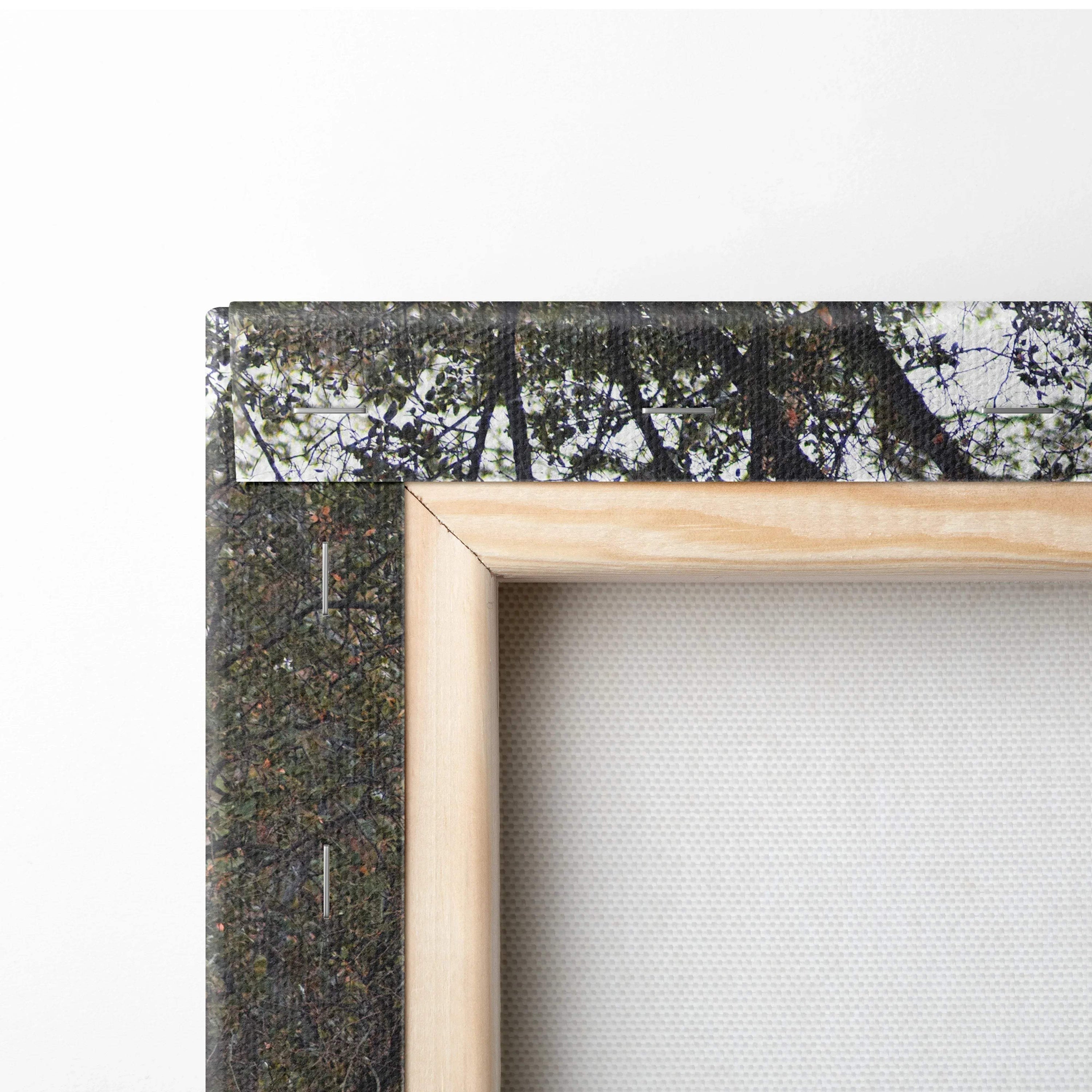 Close-up of wooden frame corner with canvas art stretched tightly for wall art display.