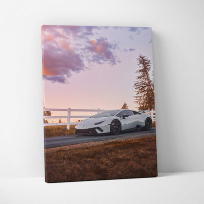 Lamborghini Huracan parked on rural road at sunset canvas wall art with soft purple sky.