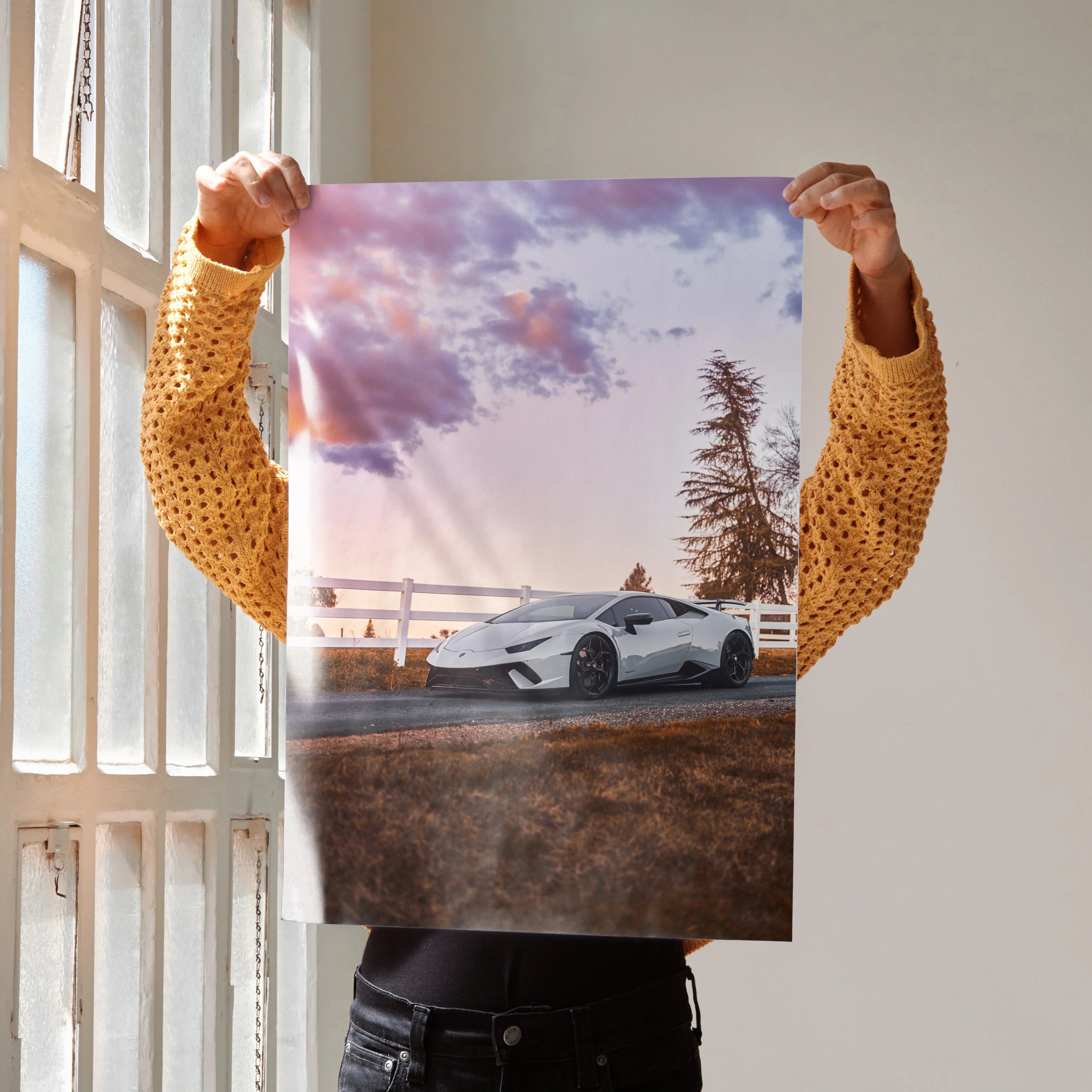 Lamborghini Huracan parked near fence under vibrant sunset sky poster wall art.