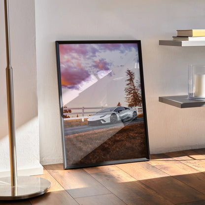 Lamborghini Huracan wall art poster featuring sleek white car at sunset with vibrant purple sky backdrop.