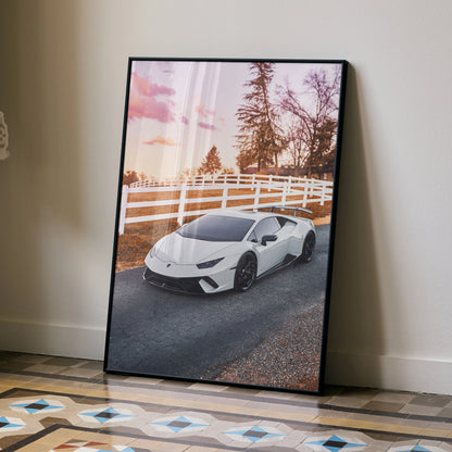 Lamborghini Huracan poster wall art featuring a white sports car on a sunset road with trees and white fence.