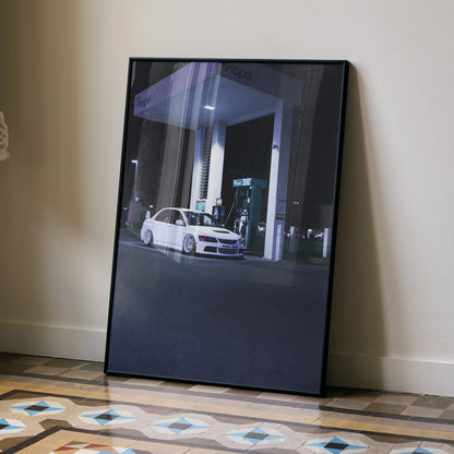 Mitsubishi Evo 8 white car at gas station nighttime poster wall art in black frame.