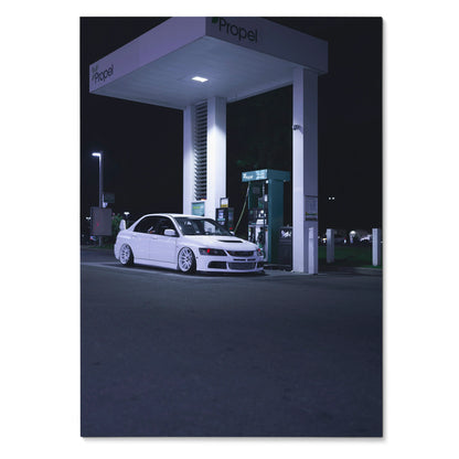 White Mitsubishi Evo 8 parked at nighttime gas station under bright lights poster wall art.