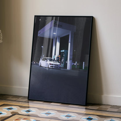 Mitsubishi Evo 8 white car at night under gas station canopy poster wall art with black frame.