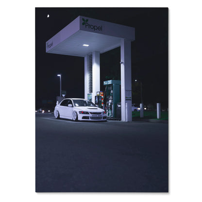 Poster of white Mitsubishi Evo 8 parked under lit modern gas station canopy at night wall art.