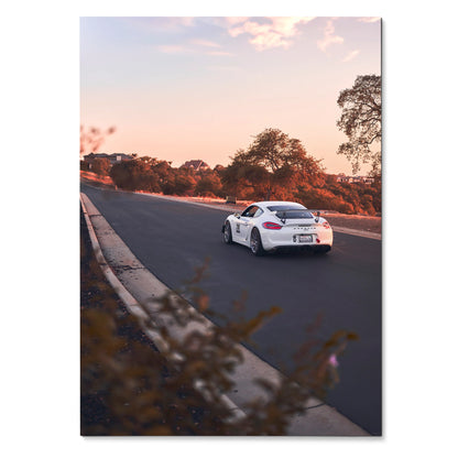 Porsche GT4 racing poster with sunset backdrop and tree-lined road wall art.