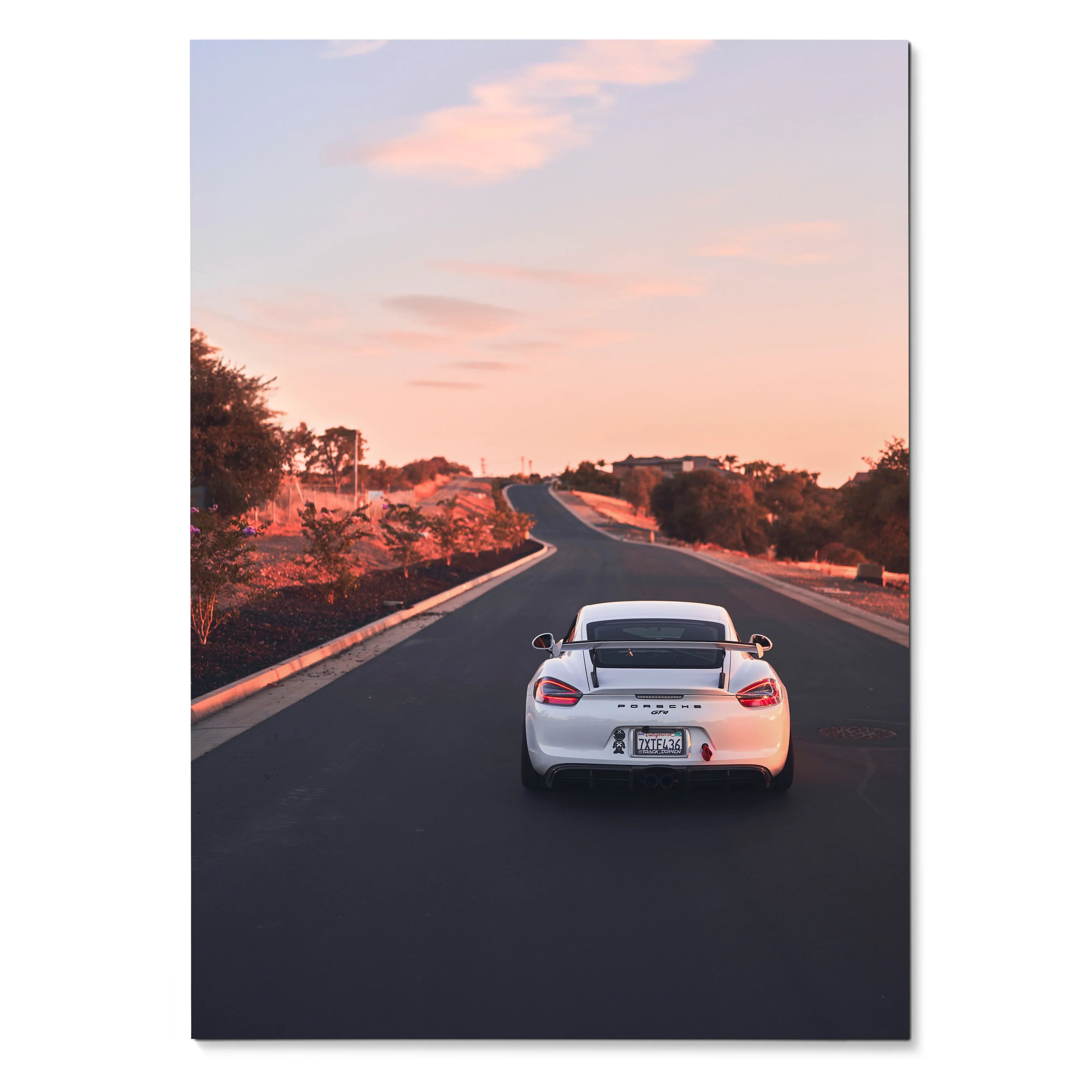 Porsche Cayman GT4 driving down empty road at sunset poster wall art.