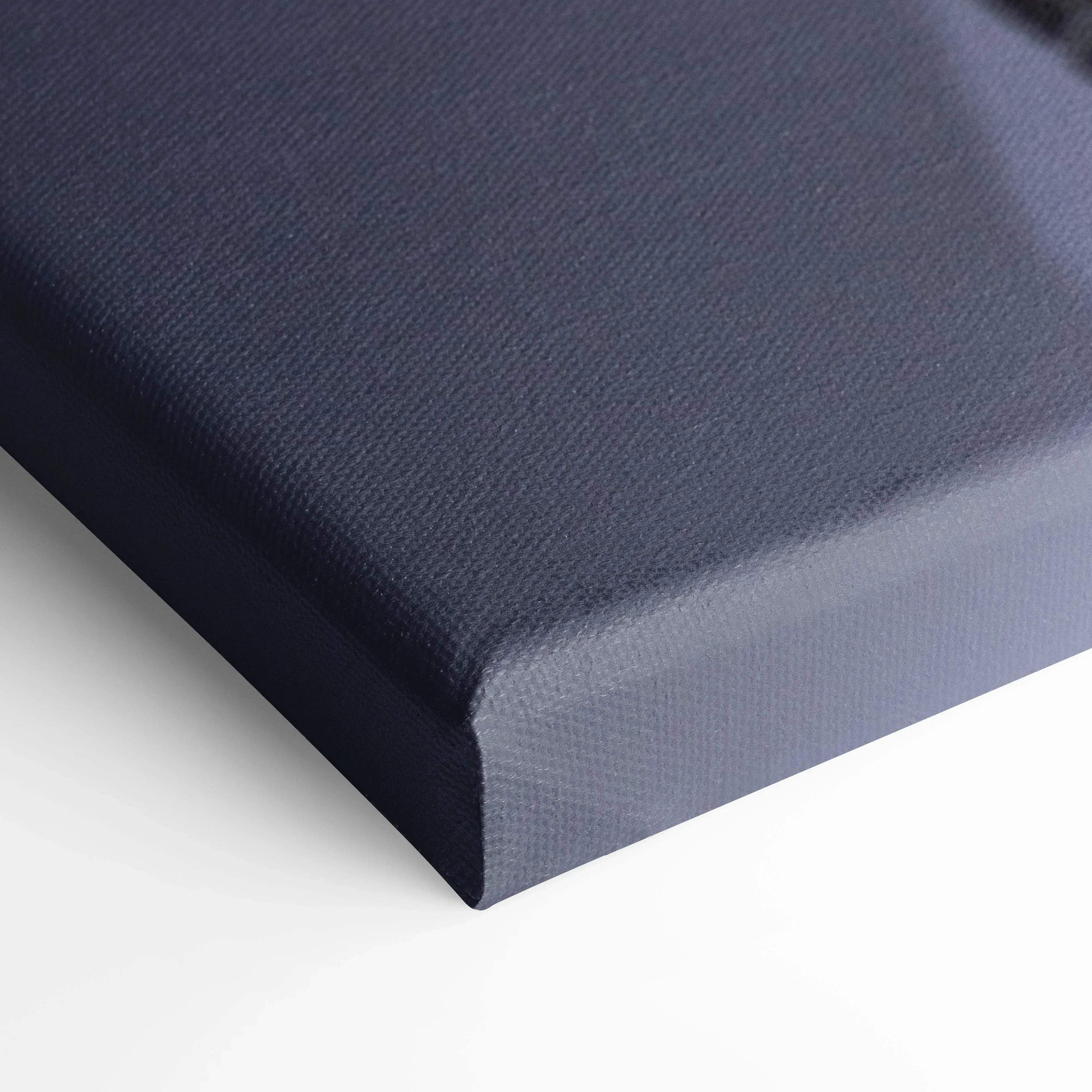 Close-up of dark gray textured canvas corner for wall art print with detailed fabric weave.