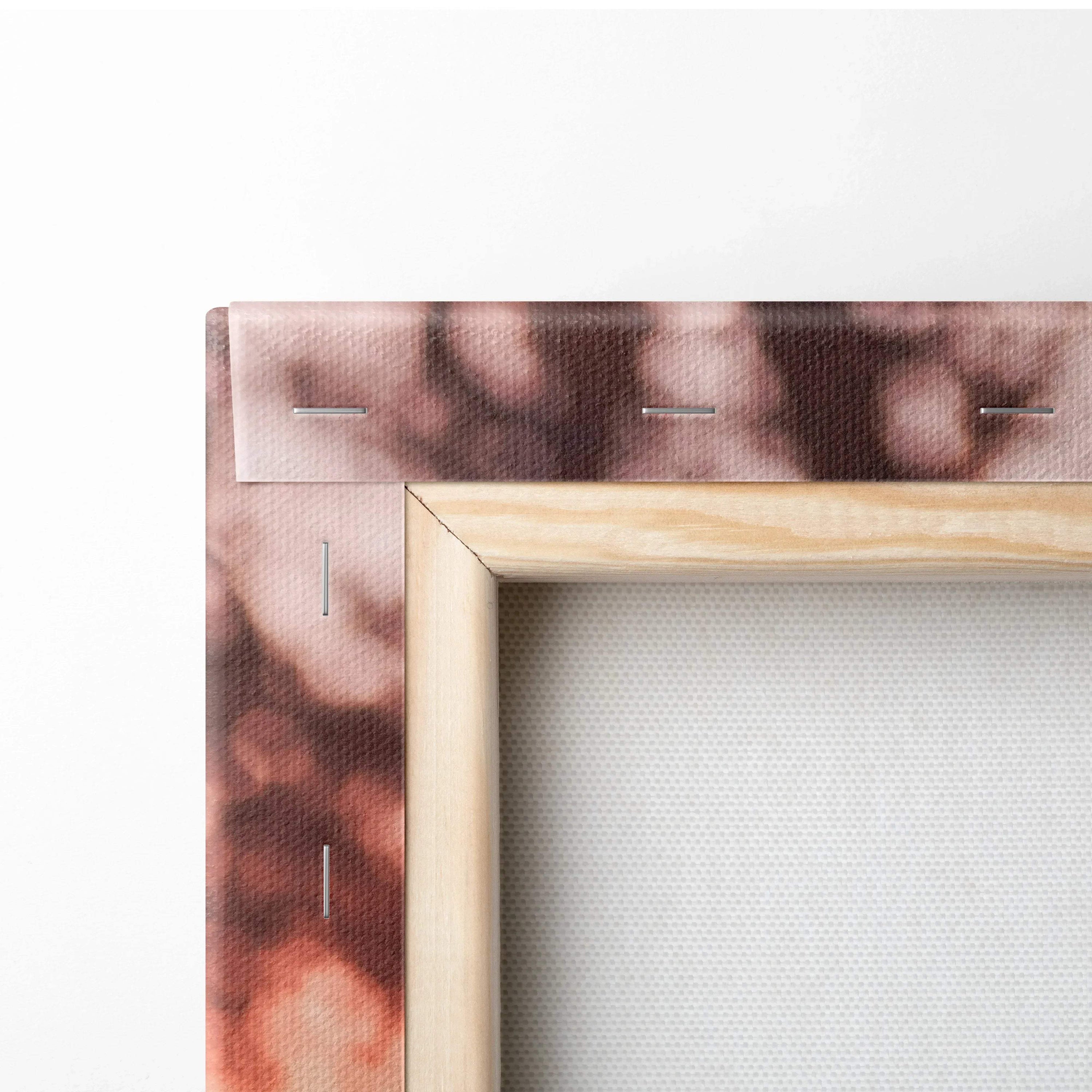 Close-up of wooden frame and canvas texture with blurred brown and pink tones in wall art canvas print.