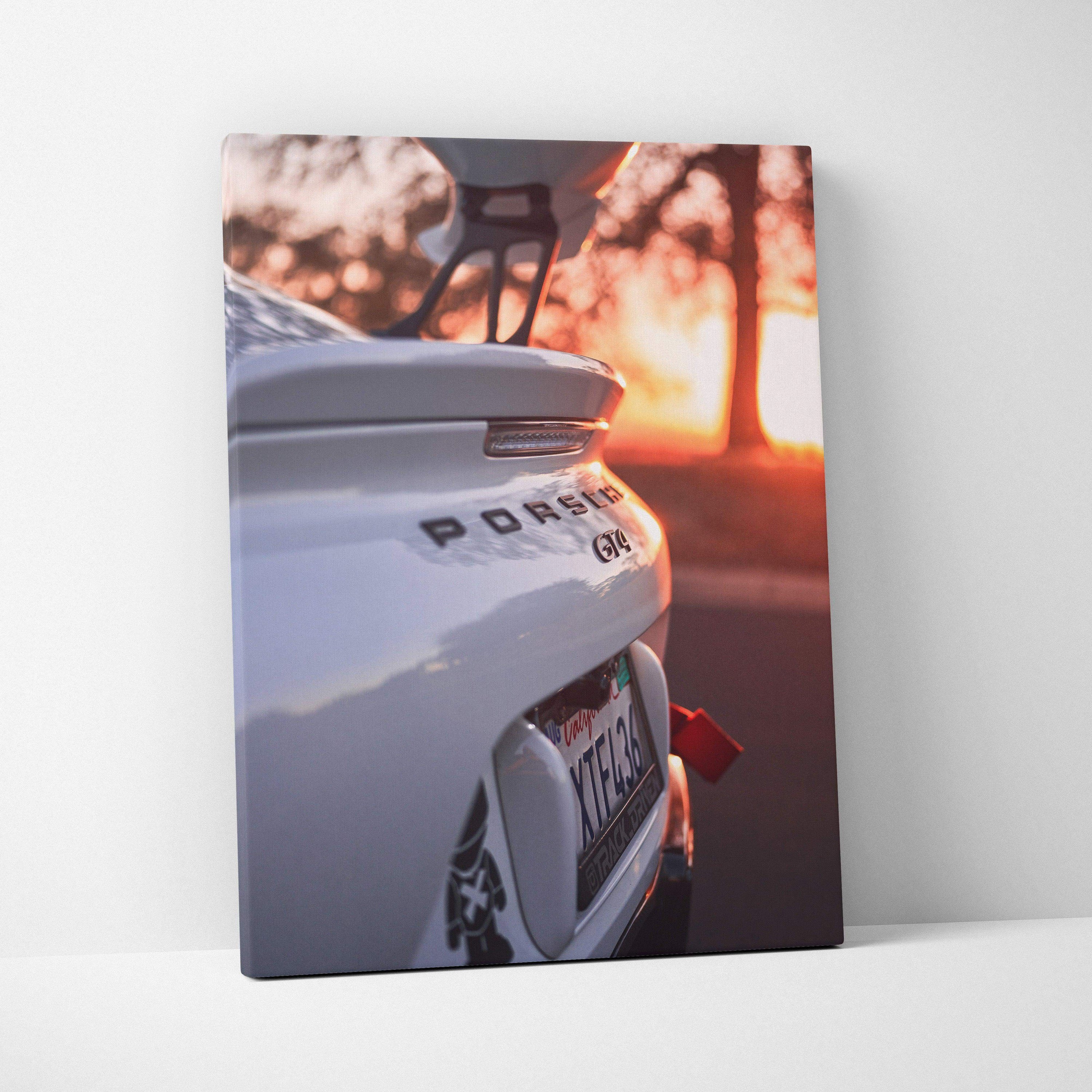 White Porsche GT4 rear detail with sunset background on vertical canvas wall art.