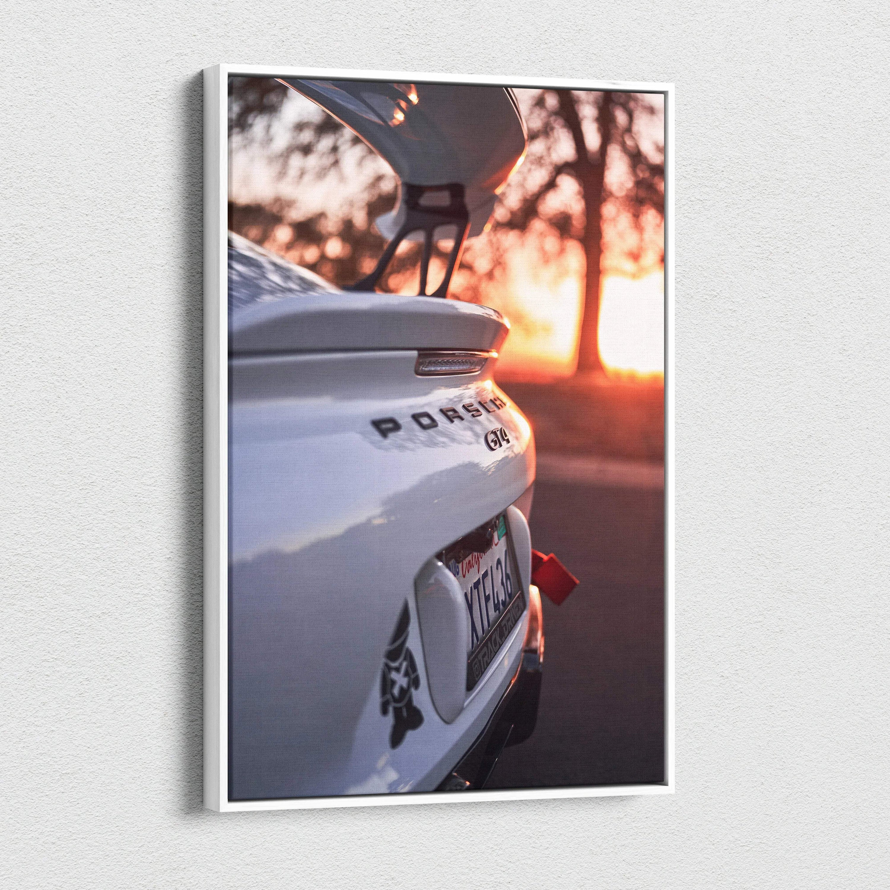 Vertical canvas wall art featuring a Porsche GT4 rear view at sunset with open spoiler.