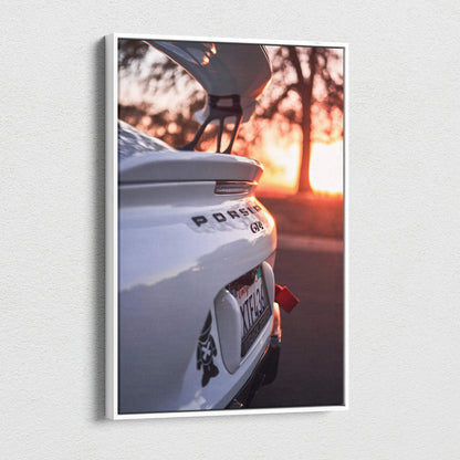 Vertical canvas wall art featuring a Porsche GT4 rear view at sunset with open spoiler.