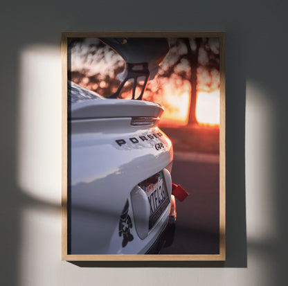 Porsche GT4 Clubman Edition rear spoiler close-up poster wall art with sunset background.