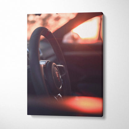 Porsche GT4 steering wheel close-up on high-resolution vertical canvas wall art with warm sunset tones.