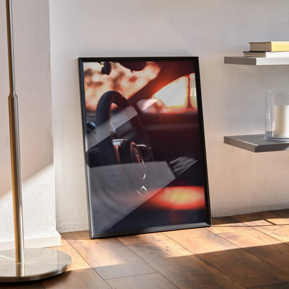 Porsche GT4 steering wheel poster leaning against wall with warm sunlight, modern wall art.