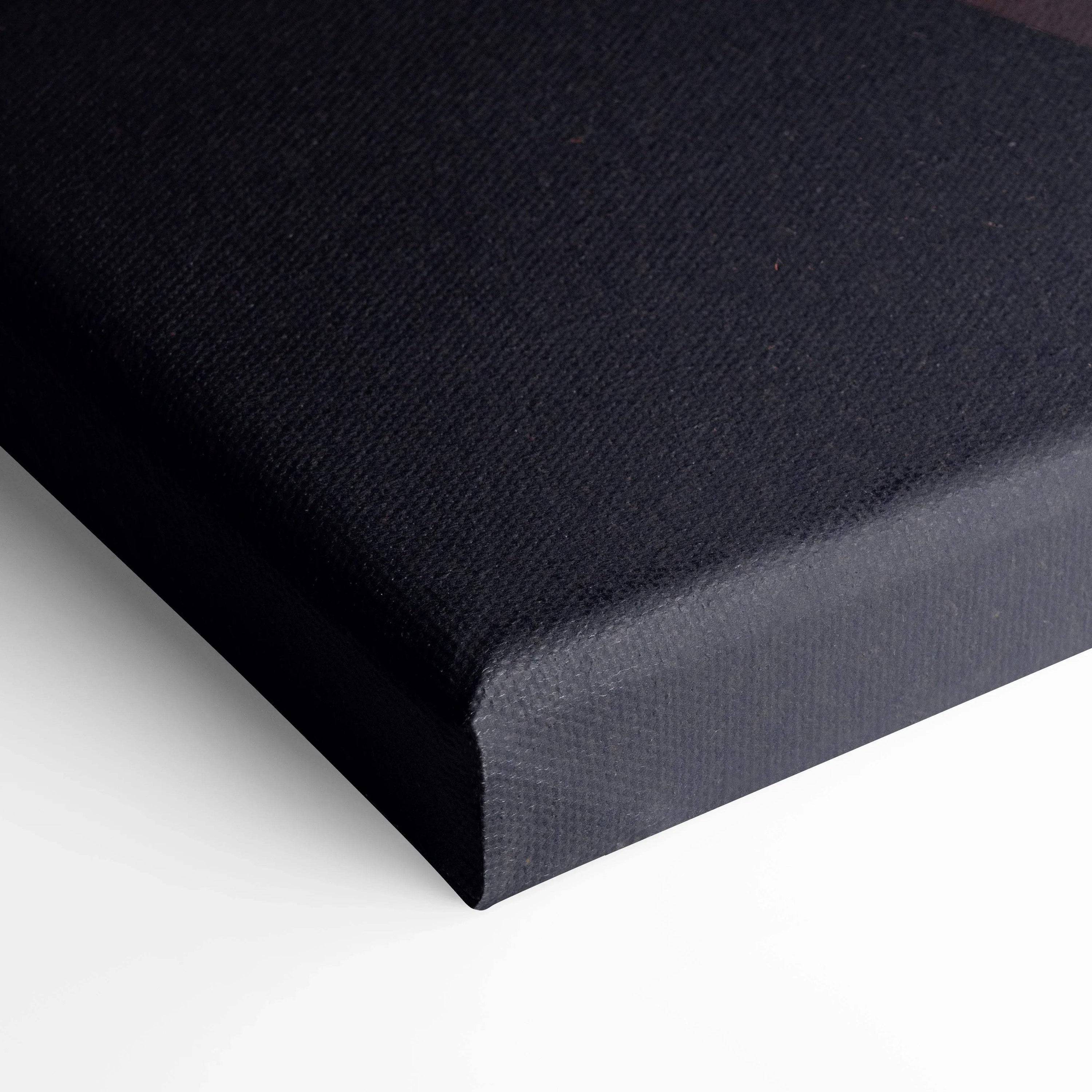 Black stretched canvas wall art corner showing textured canvas material and clean edges.