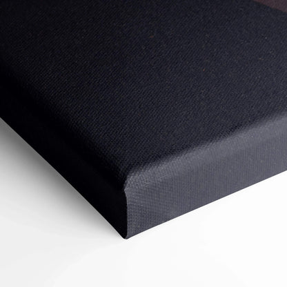 Black stretched canvas wall art corner showing textured canvas material and clean edges.