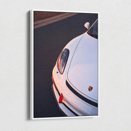 Vertical canvas wall art featuring a close-up of a white Porsche GT4 headlight and front bumper details.