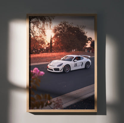 Porsche Cayman GT4 racing on sunset road luxury automotive poster wall art.