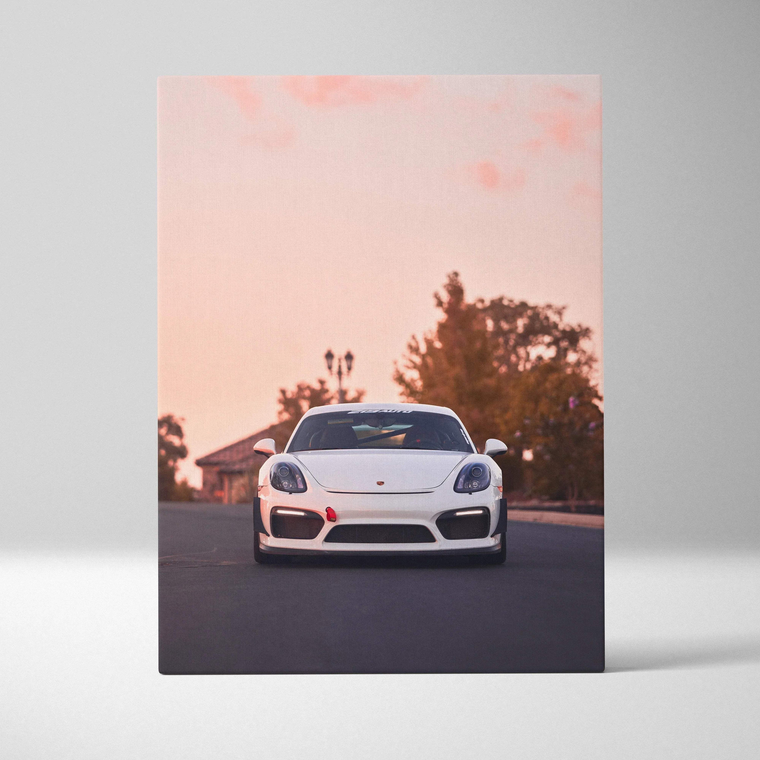 White Porsche GT4 sports car on road at sunset printed on vertical canvas wall art.