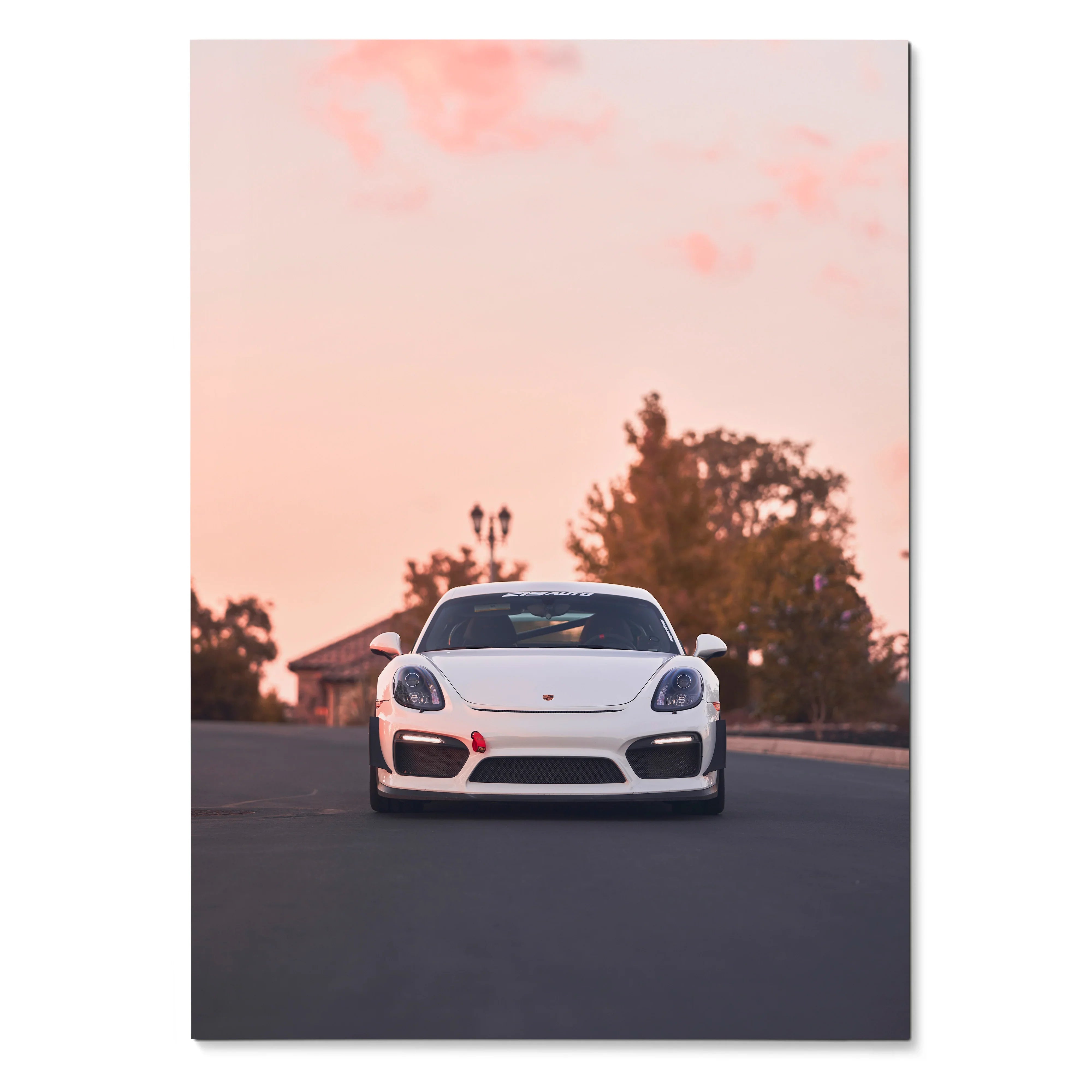 Porsche Cayman GT4 white sports car poster with pink sky and trees wall art.