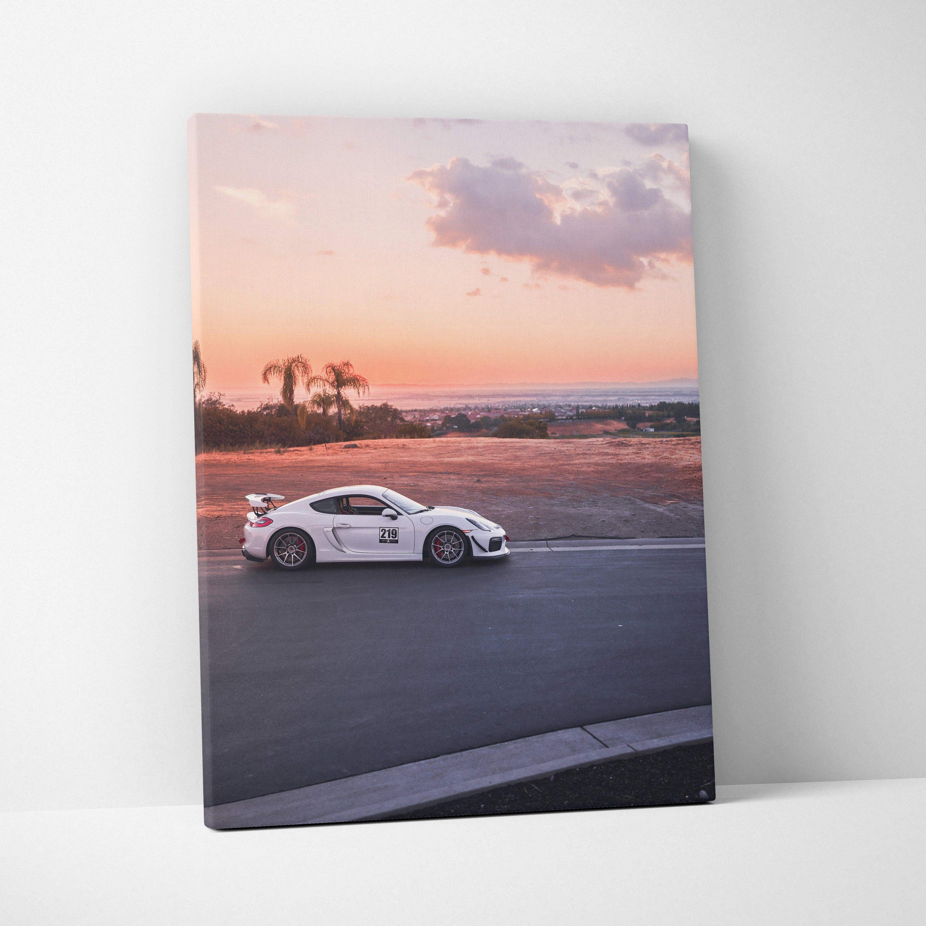 Vertical canvas art of white Porsche GT4 on racetrack at sunset wall art print.