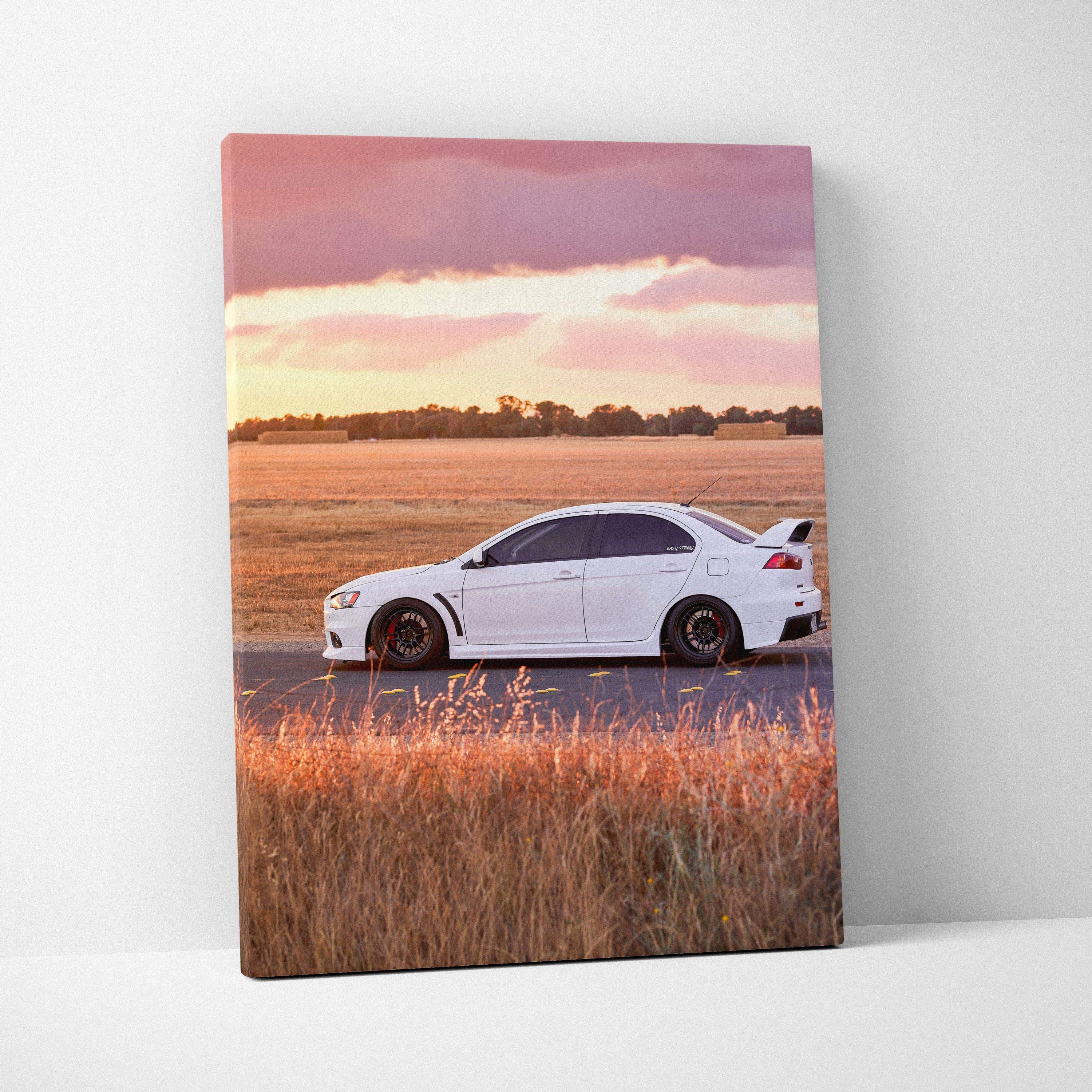 White Mitsubishi Evo 10 on road at sunset canvas wall art in vertical format.