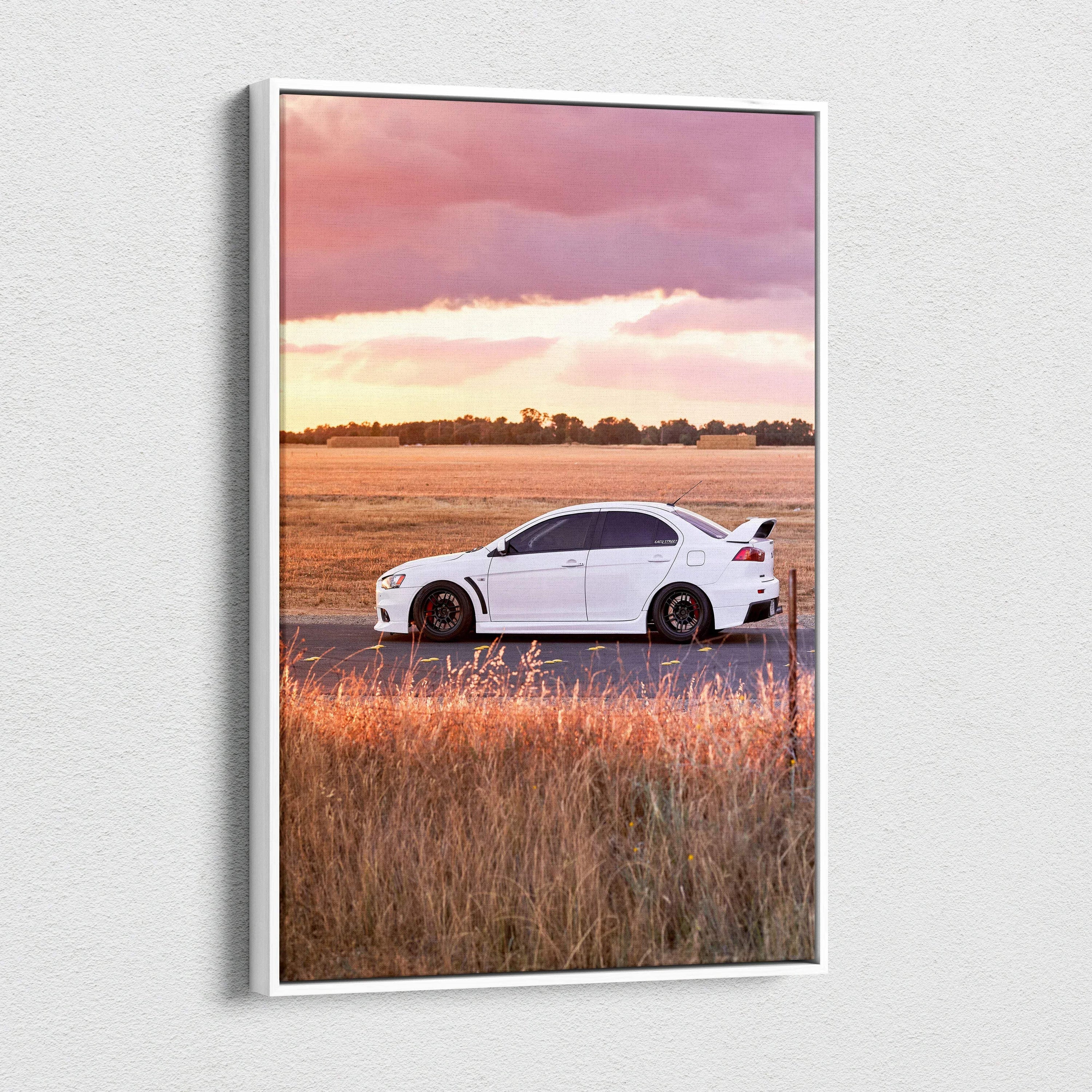 Mitsubishi Evo 10 car on dirt road at sunset canvas wall art with warm landscape colors.