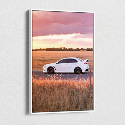 Mitsubishi Evo 10 car on dirt road at sunset canvas wall art with warm landscape colors.