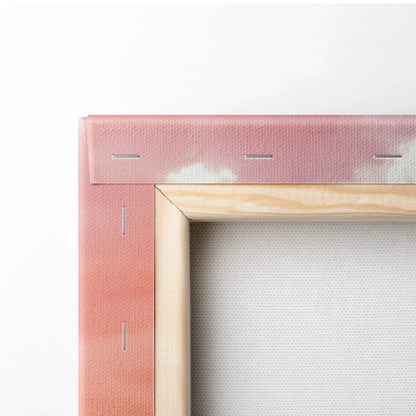 Close-up of corner-stretched pink canvas wall art with wooden frame and staples, vertical canvas art.