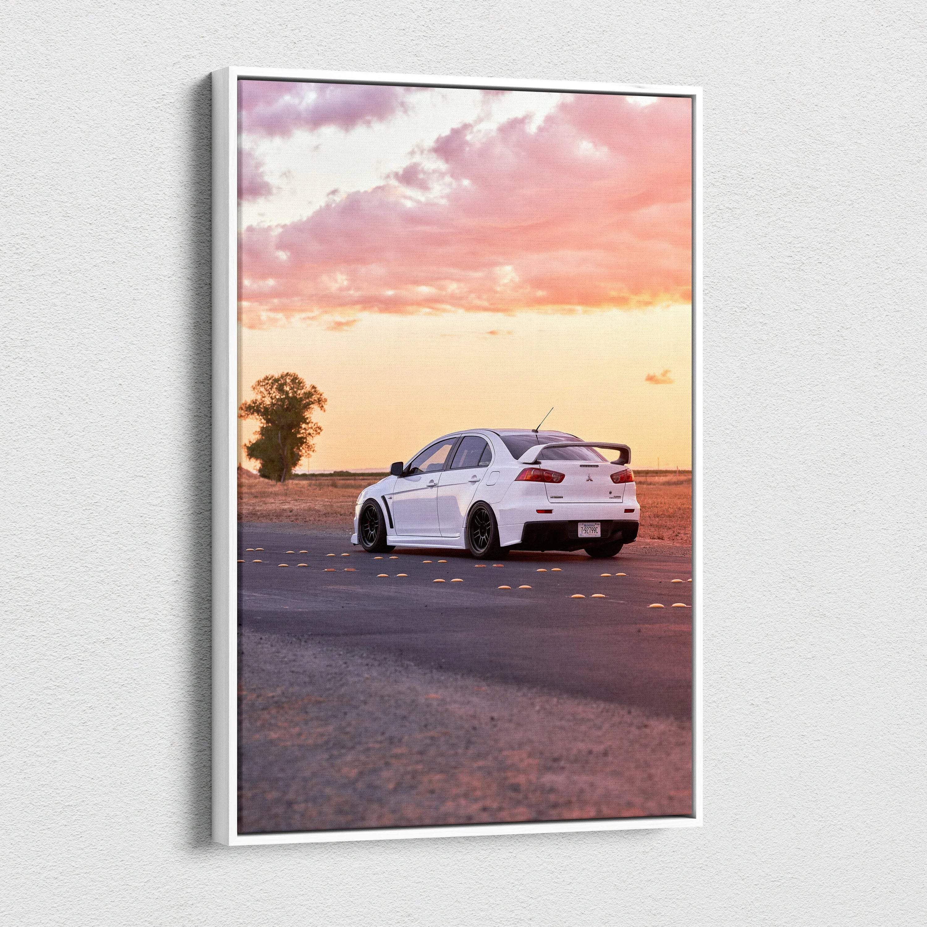 Vertical canvas wall art featuring a white Mitsubishi Evo 10 on a sunset road scene.