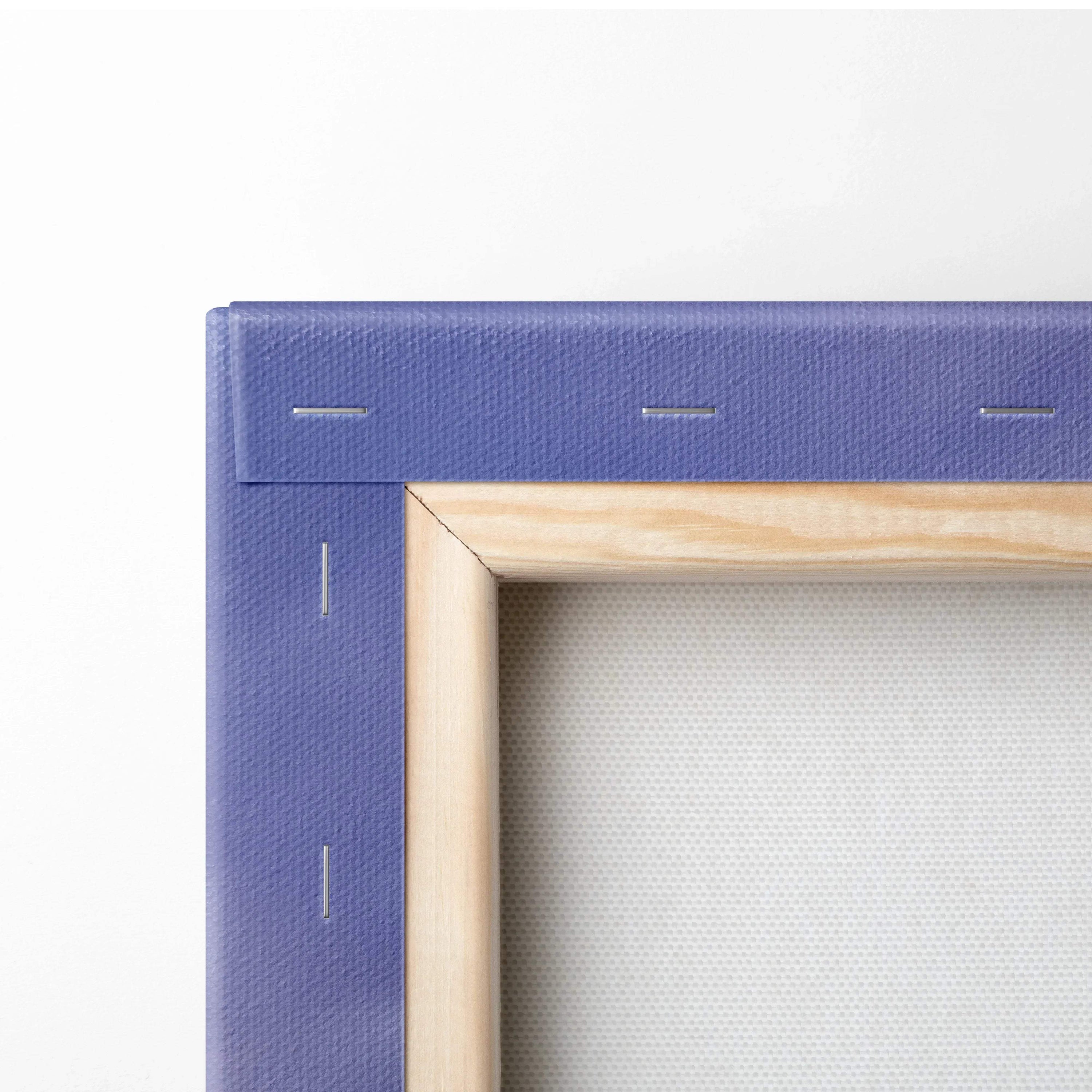 Close-up of wooden stretcher frame corner with purple canvas backing for wall art print.