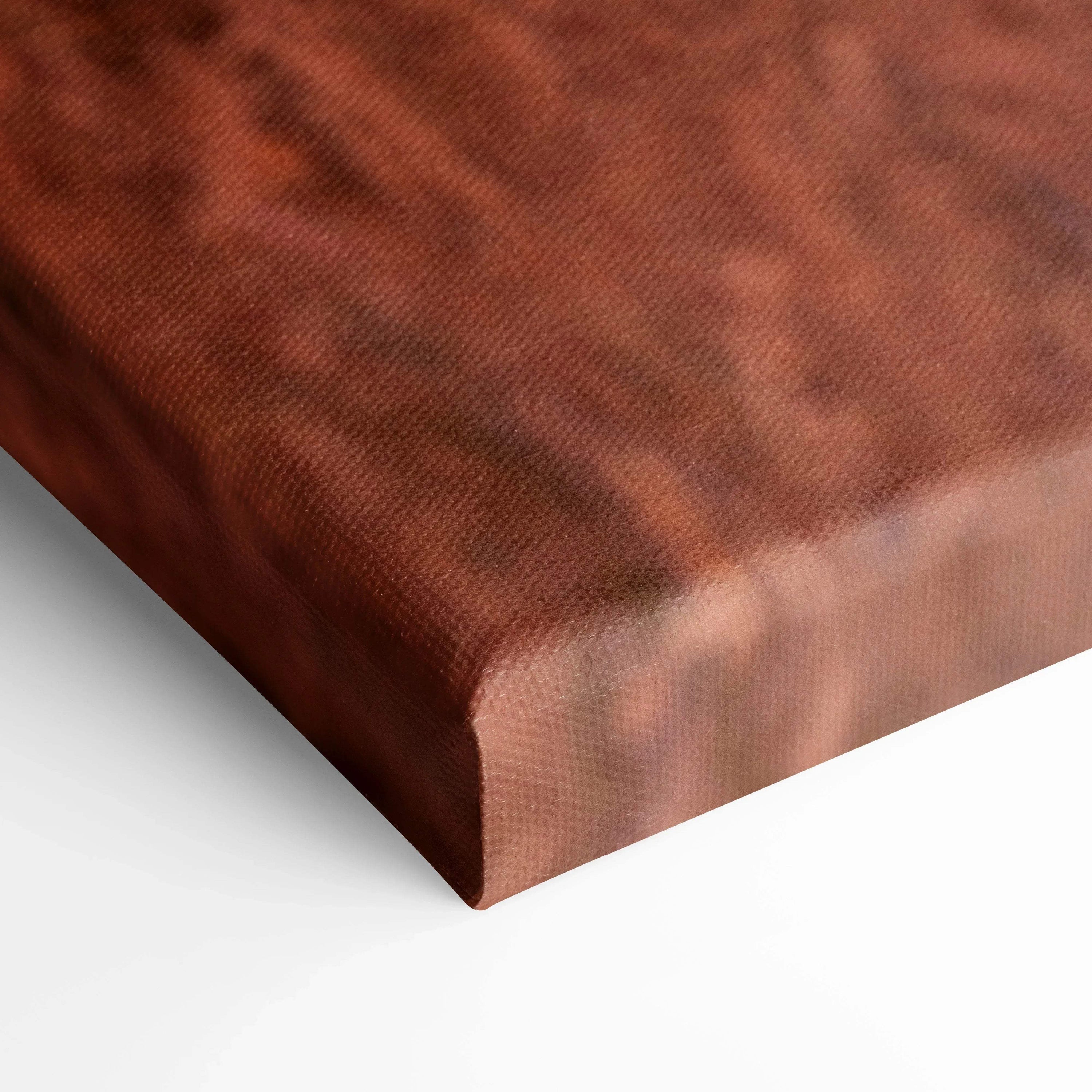 Close-up of textured vertical canvas wall art with warm brown and sunset tones.