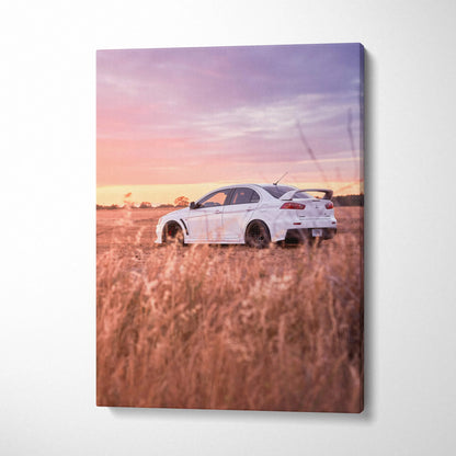 Mitsubishi Evo 10 in tall grass at sunset on vertical canvas wall art.