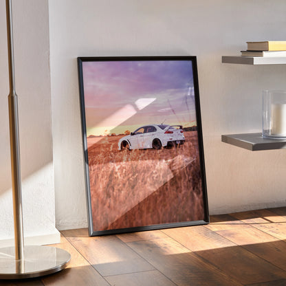 Mitsubishi Evo 10 car poster with sunset and grassy field, modern wall art in black frame.