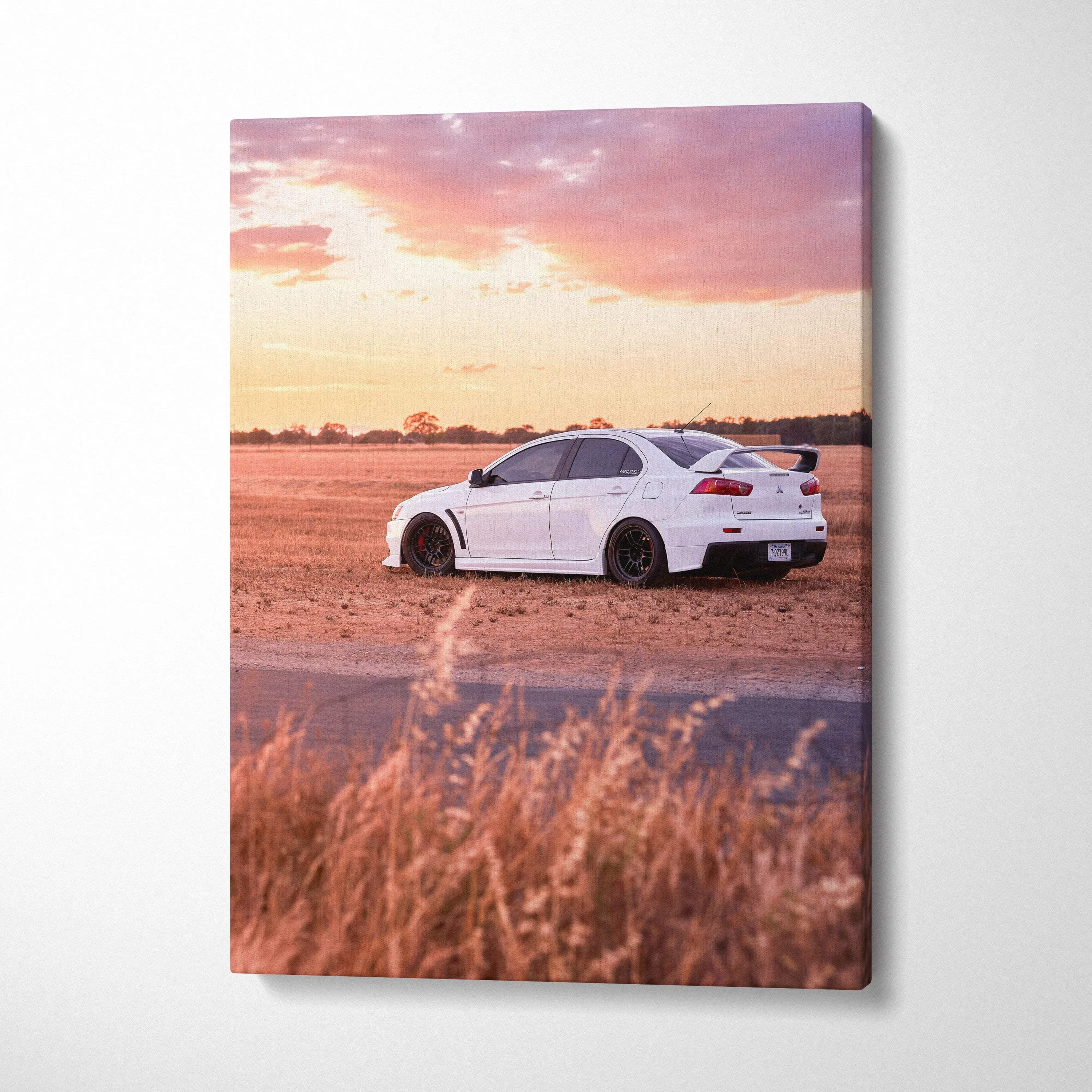 Mitsubishi Evo 10 parked on dirt road at sunset canvas wall art in vertical format.
