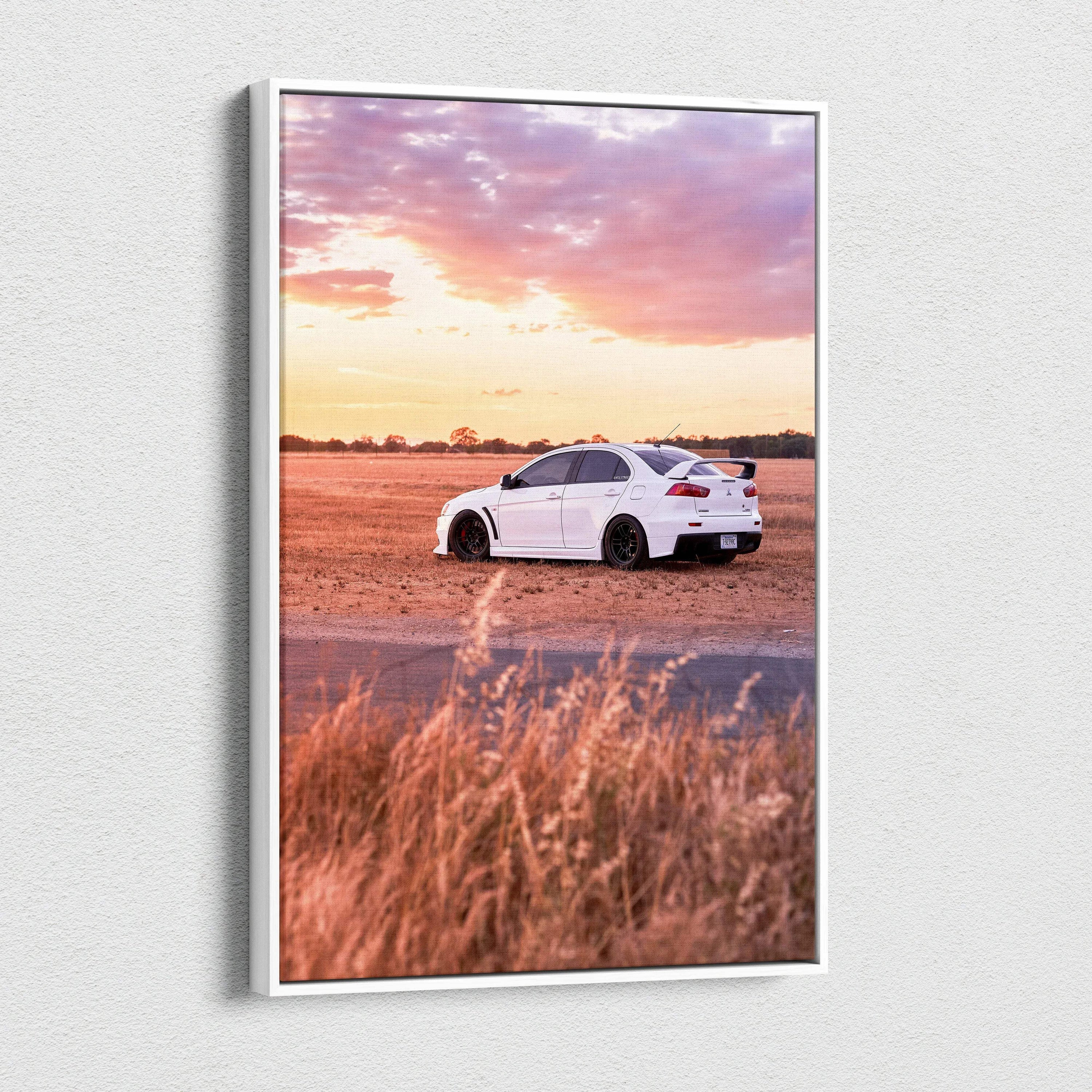 Vertical canvas wall art of a white Mitsubishi Evo 10 parked on rural road at sunset.