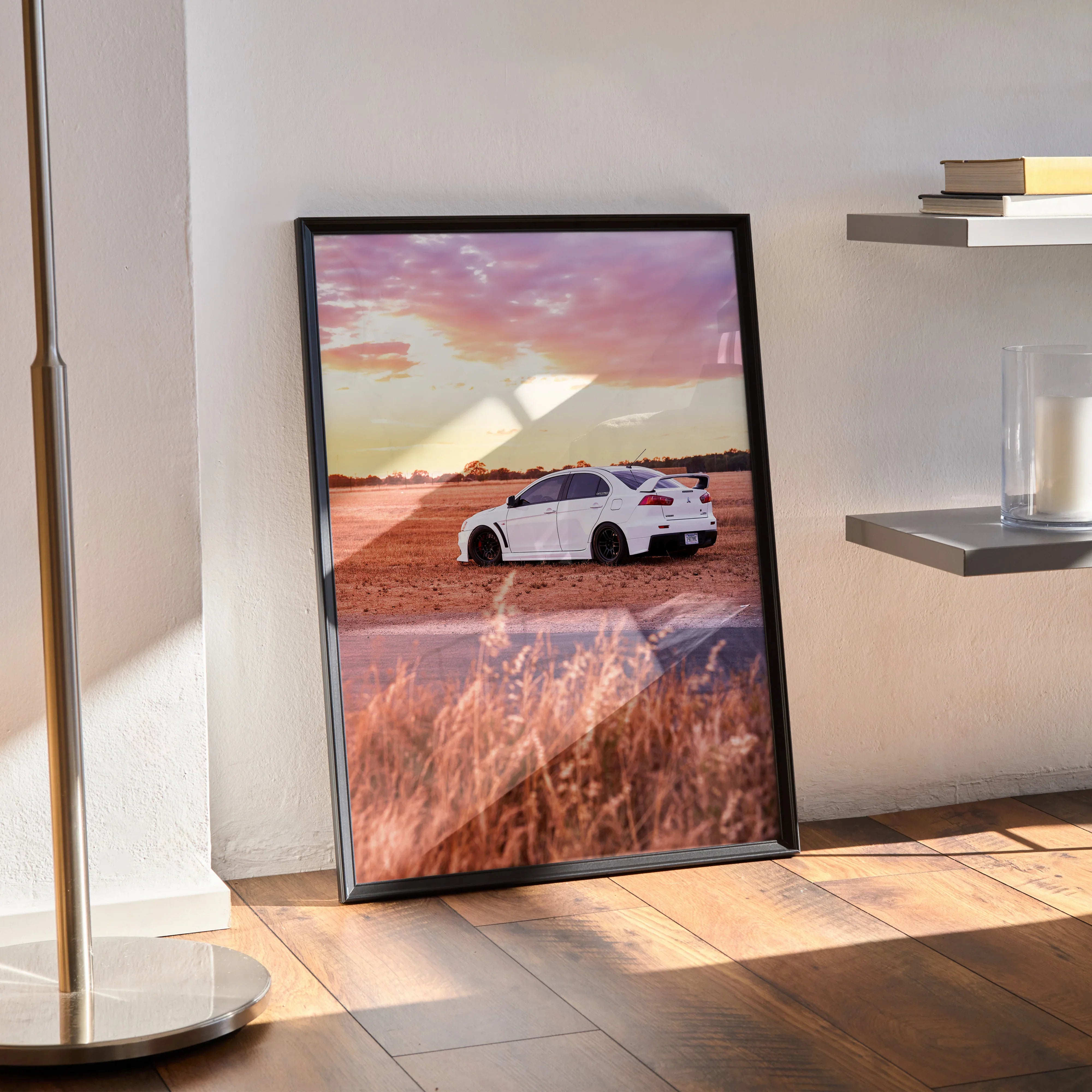 Mitsubishi Evo 10 poster with white car on sunset road, vibrant sky, wall art in black frame.