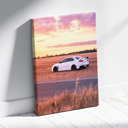 Mitsubishi Evo 10 driving on open road at sunset canvas wall art in vertical format.