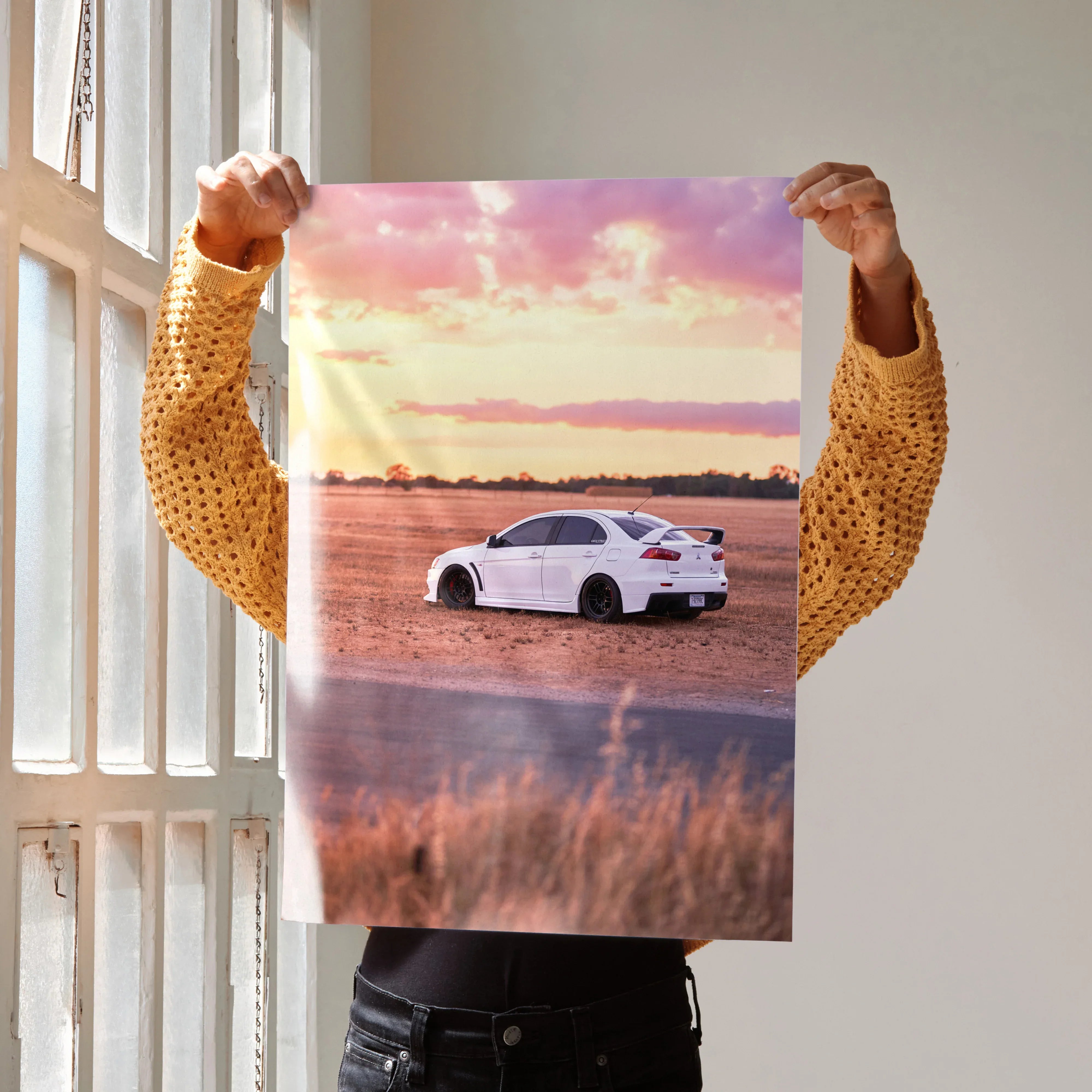 Mitsubishi Evo 10 car poster with white Evo 10 against a sunset background, high-resolution wall art.