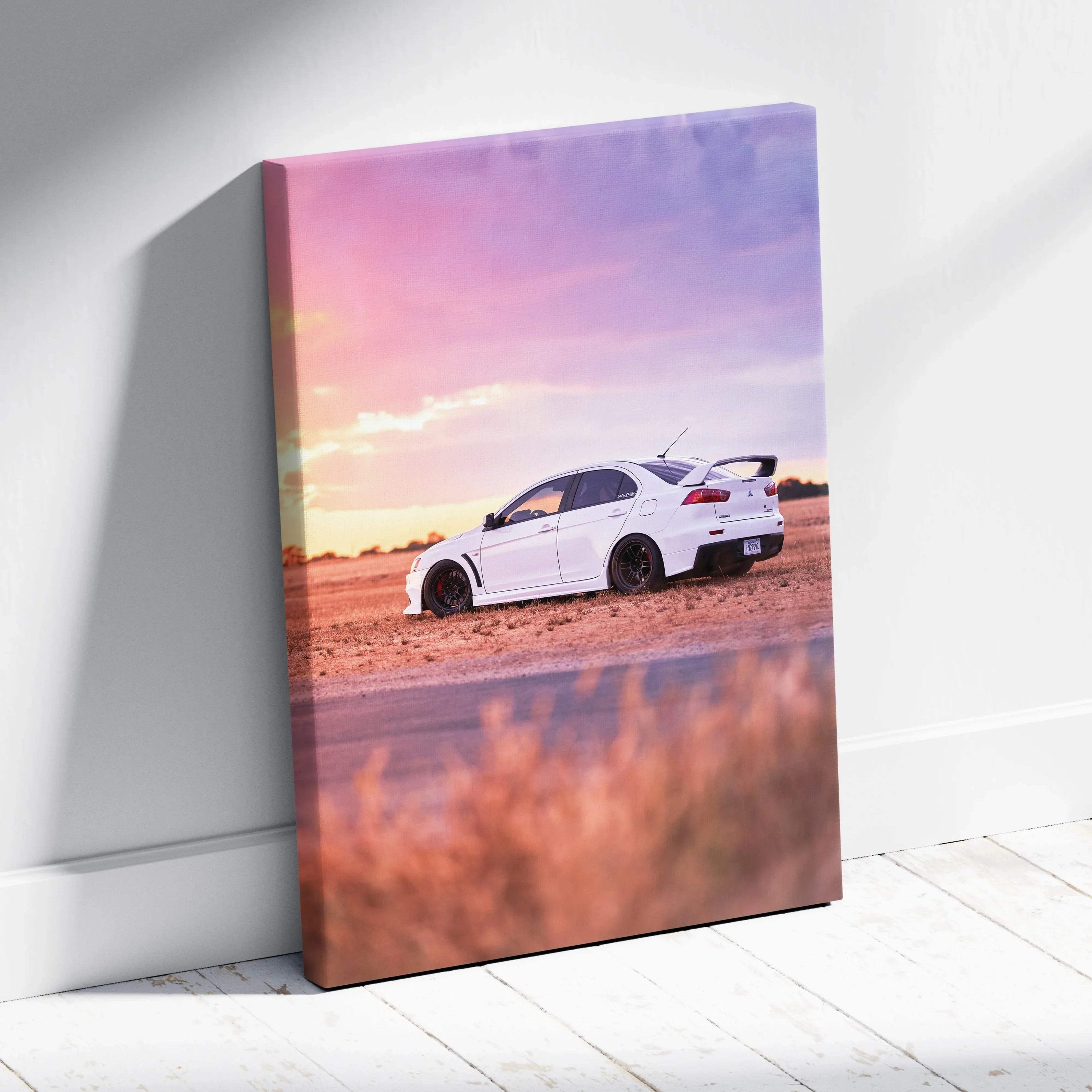 Vertical canvas wall art featuring a white Mitsubishi Evo 10 against a vibrant sunset sky.