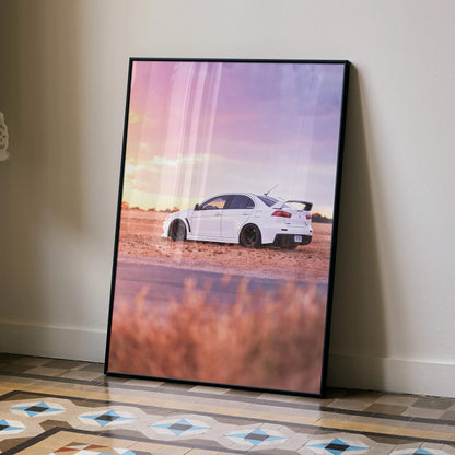 White Mitsubishi Evo 10 car at sunset on desert road poster wall art in black frame.
