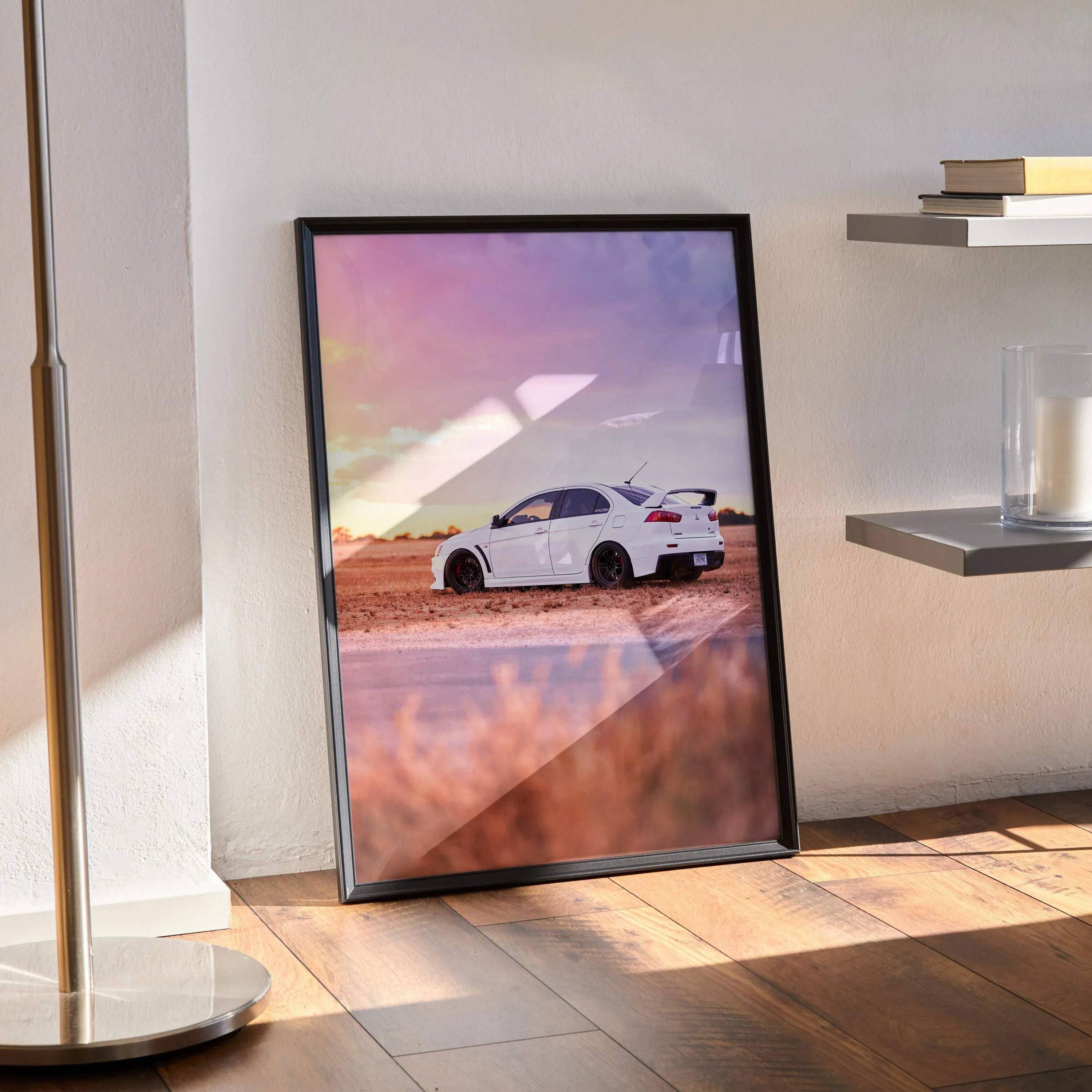 Mitsubishi Evo 10 poster wall art with white car against a colorful sunset sky.