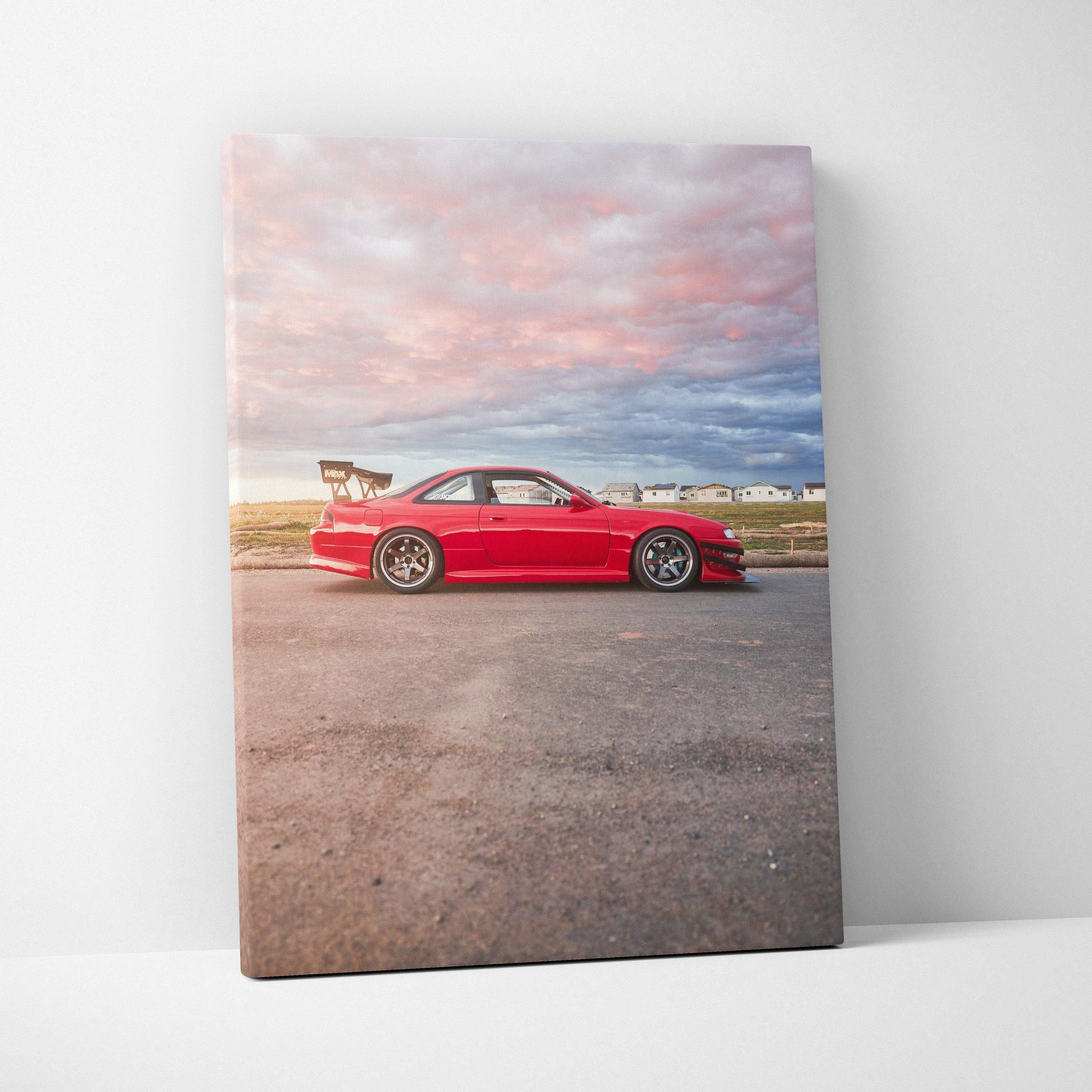 Vertical canvas art featuring a red Nissan 240sx S14 Kouki against a sunset sky, wall art print.
