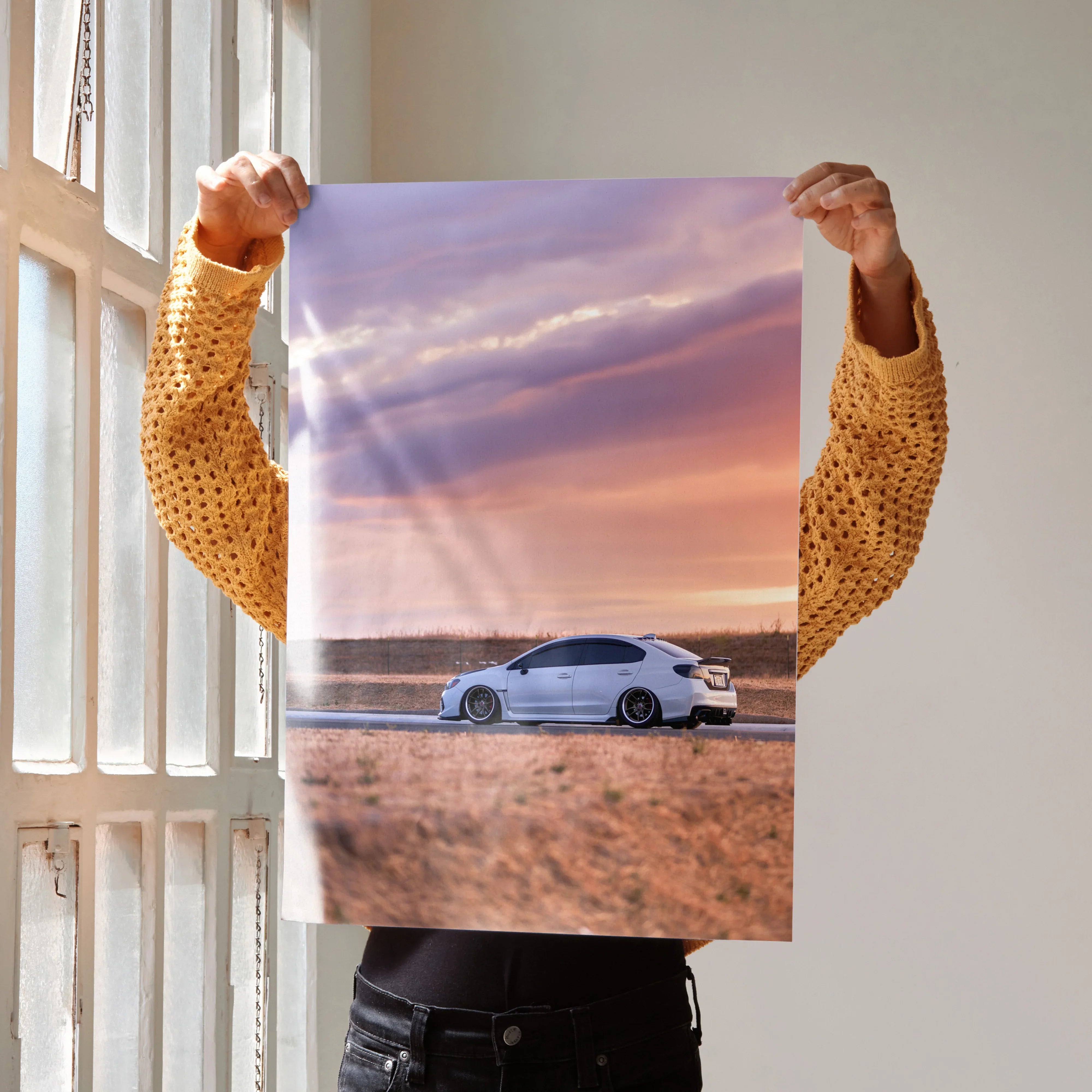 Subaru WRX poster featuring white car at sunset with purple and orange sky, premium wall art.