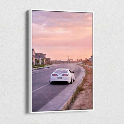 Toyota Supra MK4 on road at sunset vertical canvas wall art with pink sky.