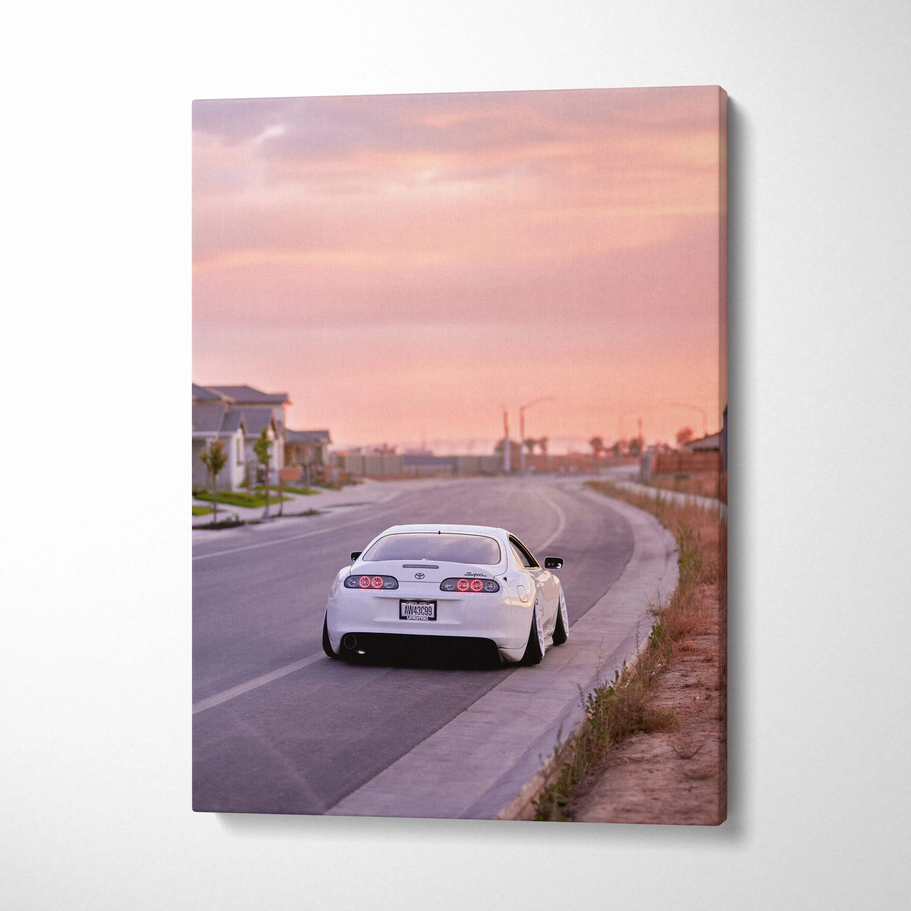 Toyota Supra MK4 in white on road at sunset canvas wall art vertical print.